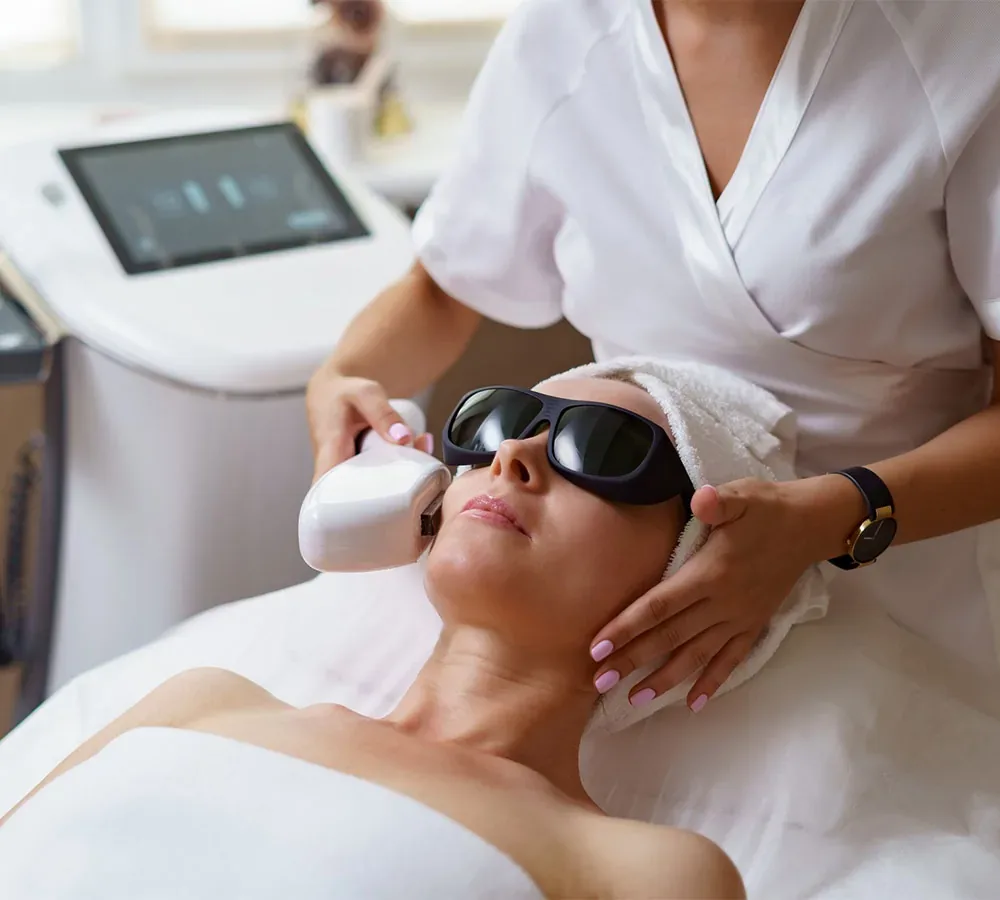 Woman with protective goggles during laser skin rejuvenation